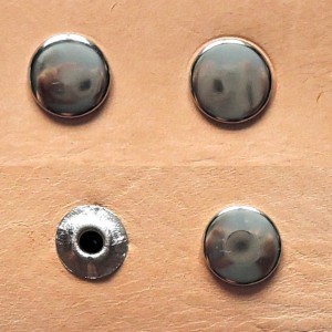 Obverse and reverse side: a) open rivet, b) closed rivet